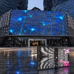 High-definition outdoor transparent LED screen integrated with glass curtain wall for building advertising